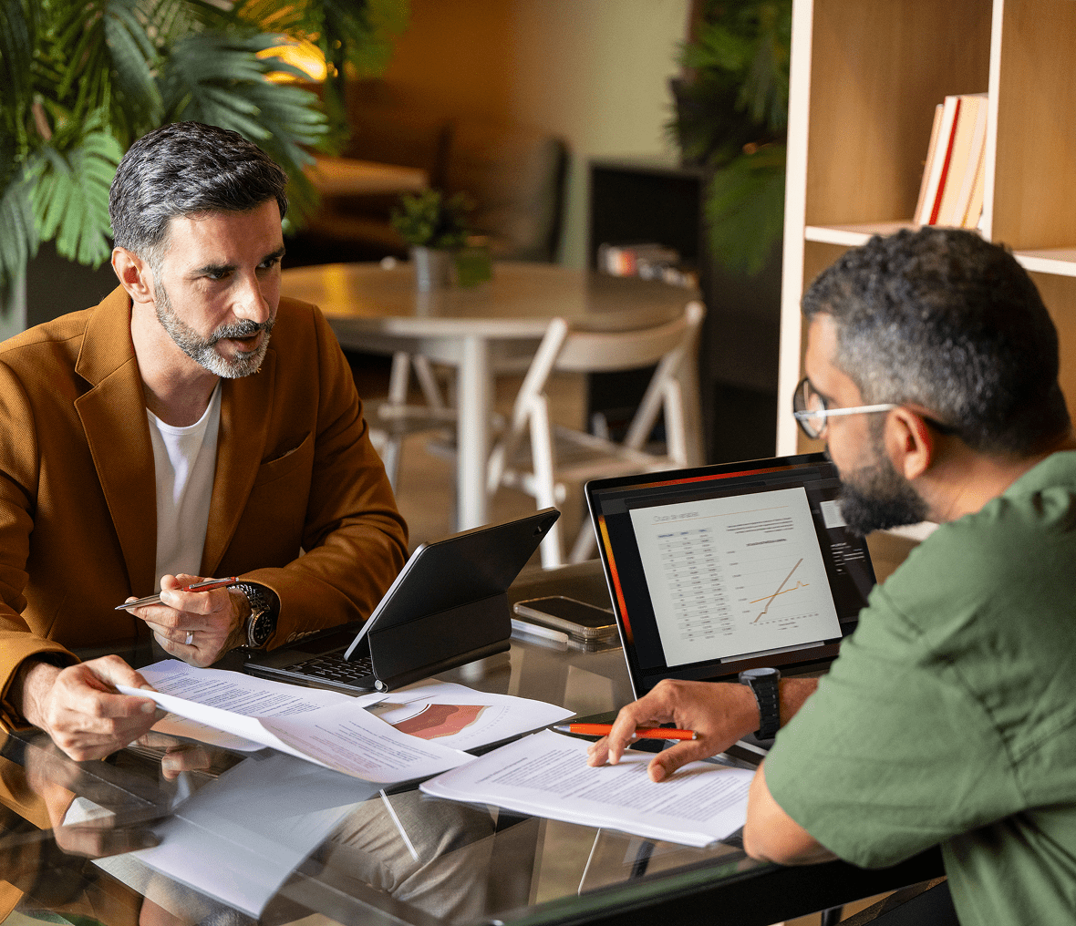 Colleagues reviewing charts in office setting